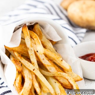 Delicious Air Fryer French Fries in a basket, perfect for sharing.
