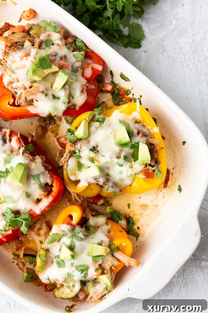 A baking dish filled with pork stuffed peppers