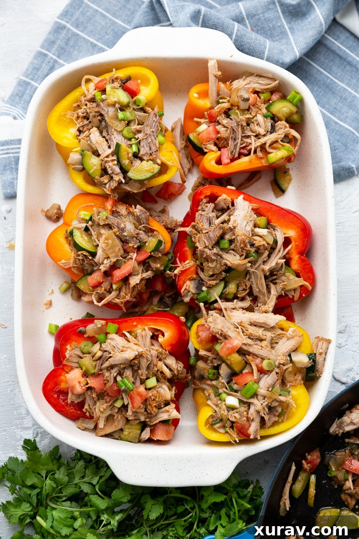 Pork Stuffed Peppers in a baking sheet, before it is topped with mozzarella