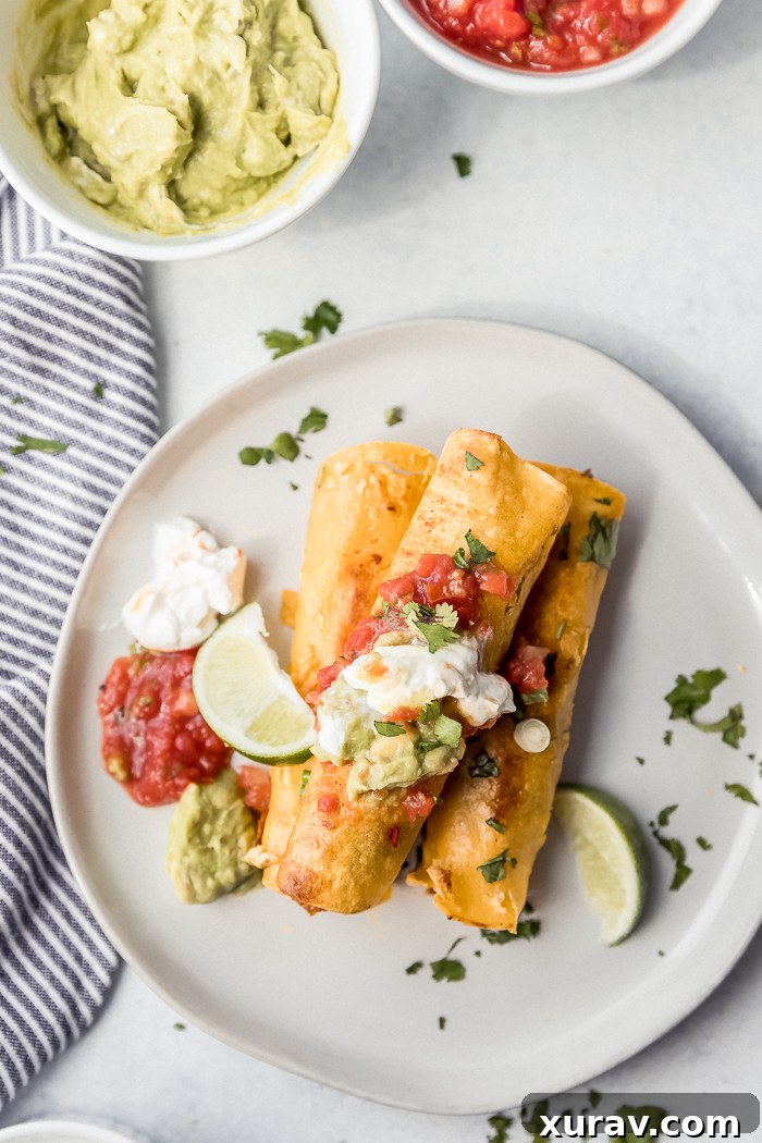 A white plate with breakfast taquitos