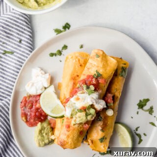 A white plate with breakfast taquitos
