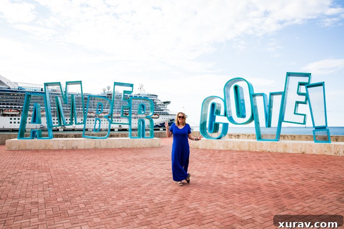 Adventurers sliding down natural waterfalls at Damajagua in Amber Cove.