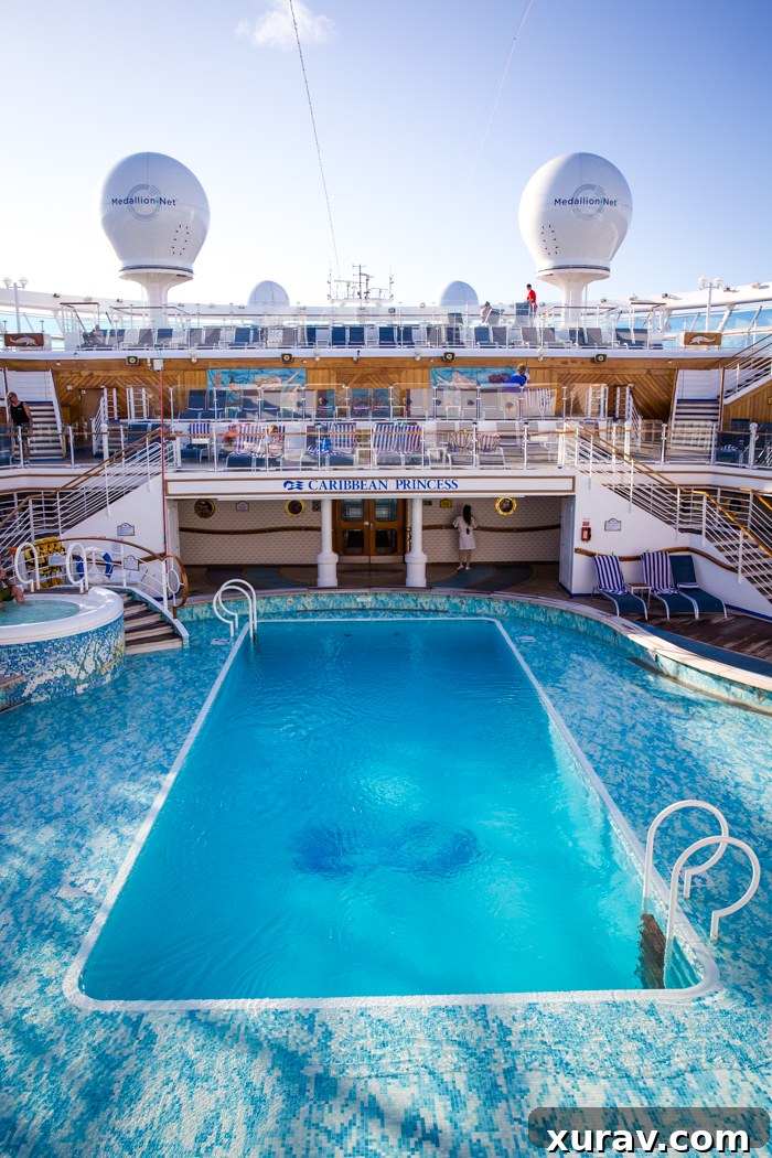 A vibrant cruise ship deck with pool, activities, and sunny weather.