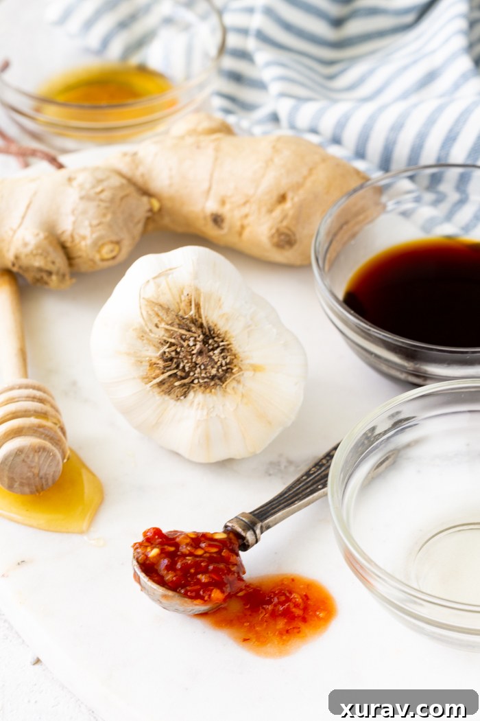 Marinated chicken and pork in separate dishes.