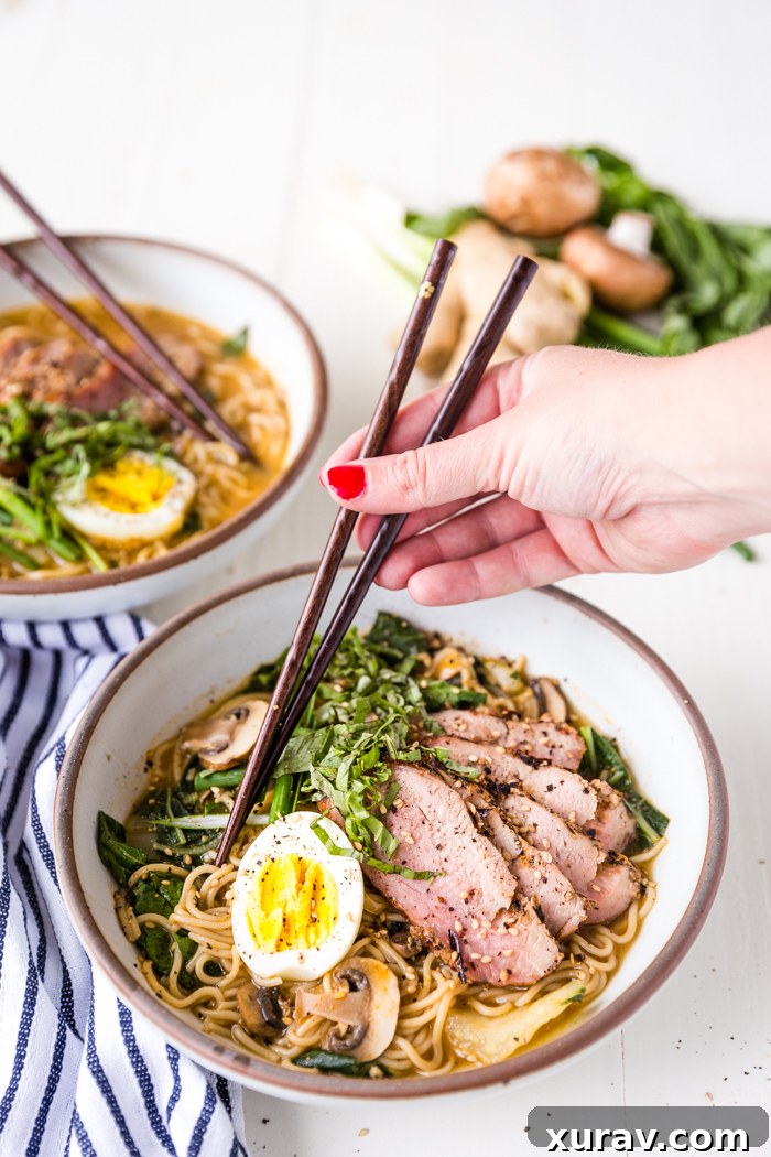 Grilled Pork Ramen with a soft-boiled egg and fresh herbs