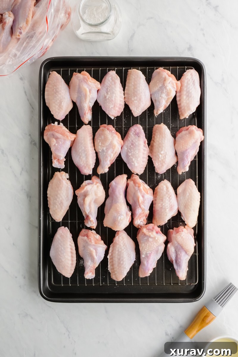 Baking wings on a cooling rack inside a baking sheet