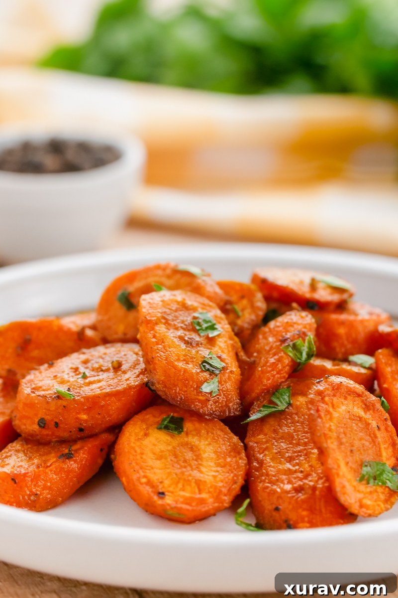 Assortment of roasted root vegetables, including carrots, on a serving platter
