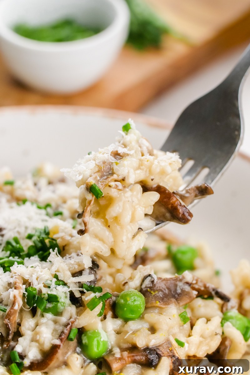 Mushroom risotto being stirred in a pan
