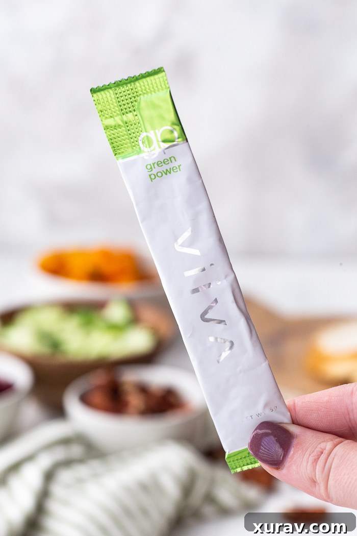 Viiva Organic Green Power sachet next to a bowl of fresh Fall Salad ingredients, highlighting the nutritional boost.