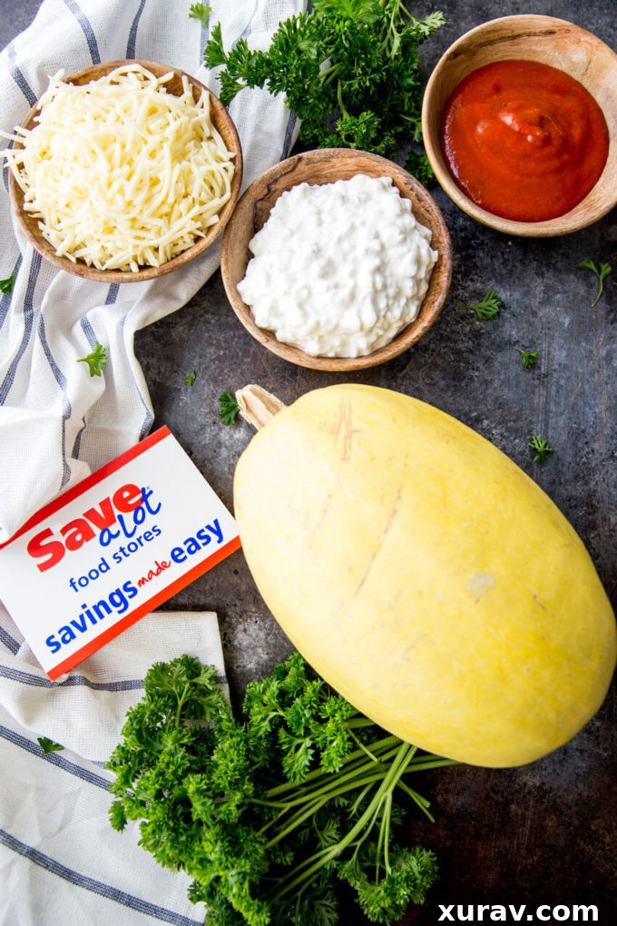 A large spaghetti squash half filled with rich lasagna ingredients and topped with melted cheese, ready for the oven.