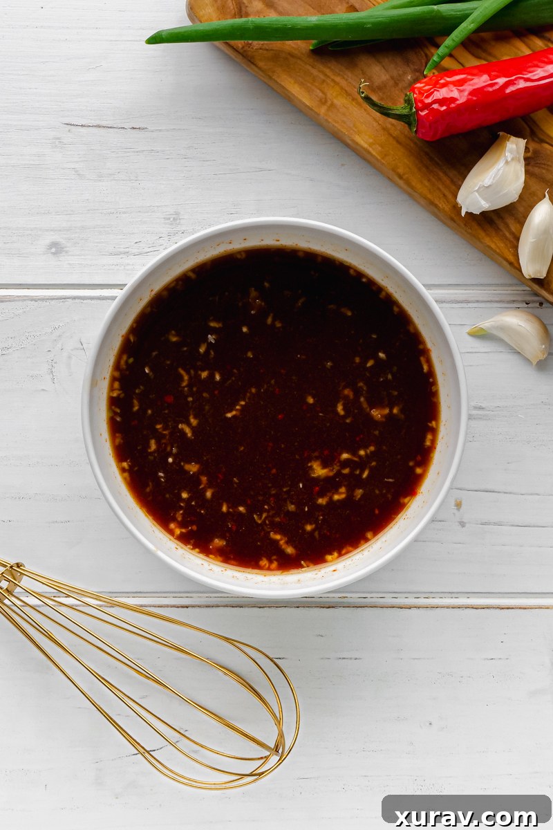 Ingredients for Kung Pao sauce laid out, showing the various liquids and spices.