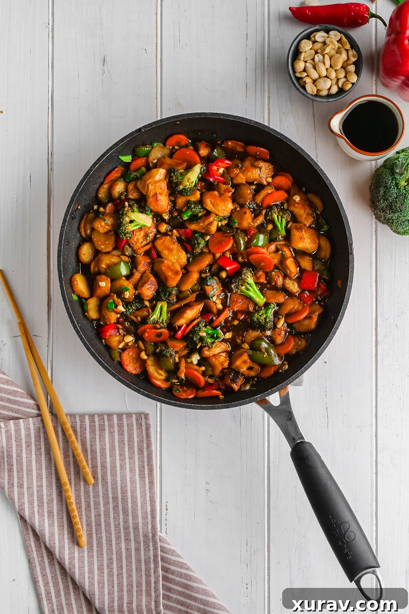 Seven distinct bowls of Kung Pao Chicken, each perfectly garnished and presented.