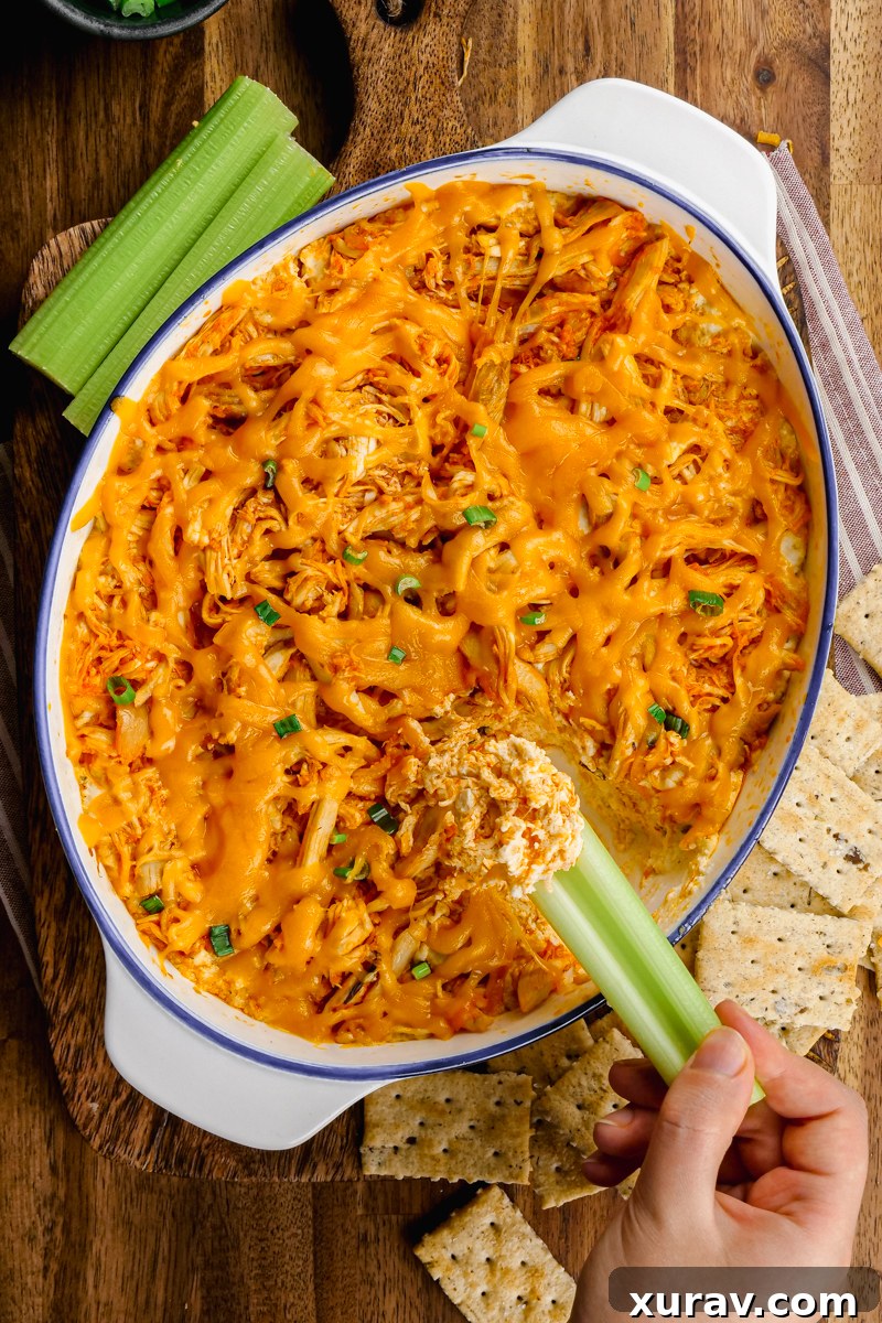 Delicious Buffalo Chicken Dip served with celery and crackers