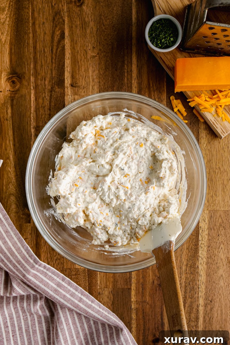 Buffalo Chicken Dip ready to be served, garnished with green onions