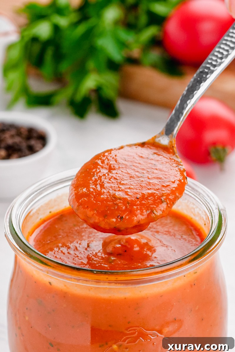 Individual servings of keto marinara sauce stored in small containers, ready for meal prep.