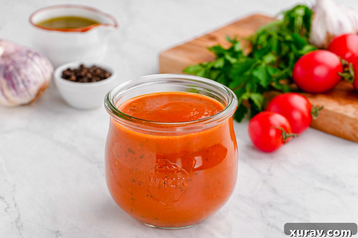 A bowl of keto marinara sauce with fresh basil and some bread (or low-carb crackers) on the side.