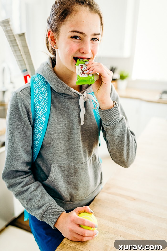 A hand holding a Bob's Bar in an outdoor setting