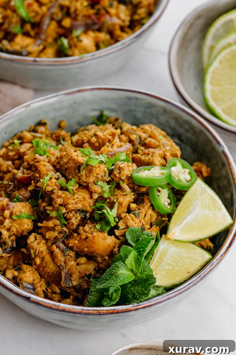 Close-up of Keto Chicken Biryani, showing the texture of cauliflower rice and chicken.