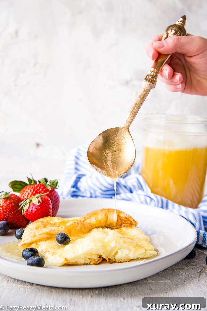 Buttermilk syrup drizzled over waffles with berries
