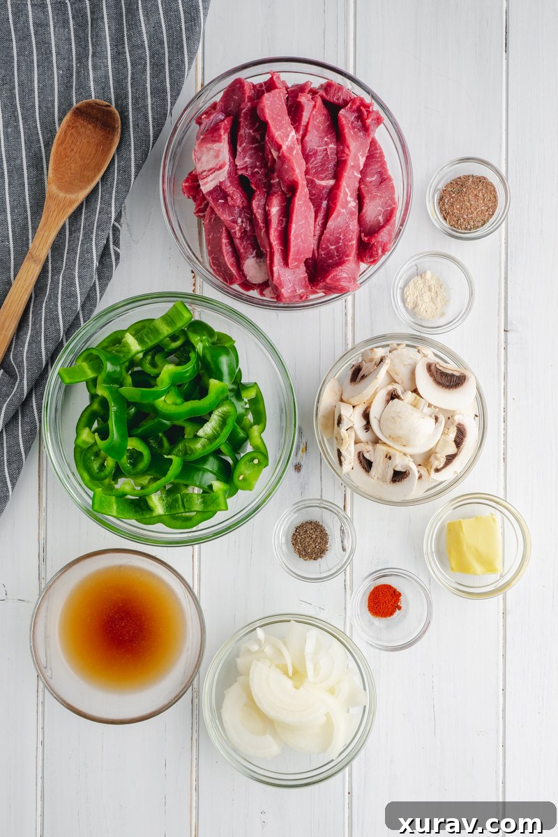 A close-up shot of the savory Crockpot Philly Cheesesteak filling, rich with steak, melted cheese, and vegetables.