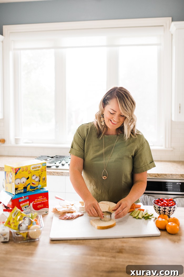 A woman in a green shirt making lunches