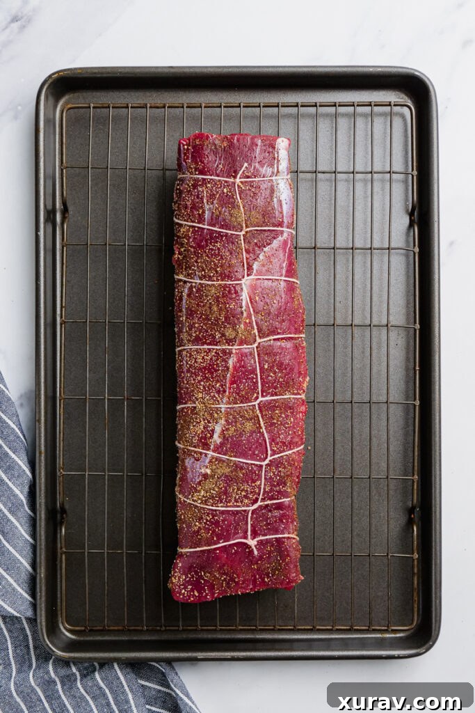 A prepped and tied roast beef tenderloin, ready for seasoning