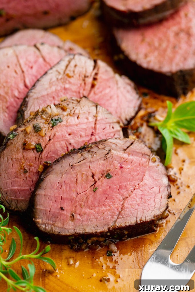 Herb butter generously rubbed over a perfectly cooked roast beef tenderloin