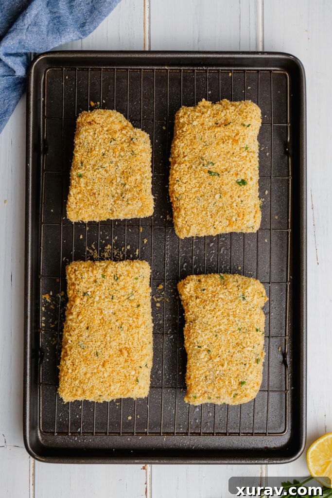 Baking oven fried fish on a sheet pan with a wire rack