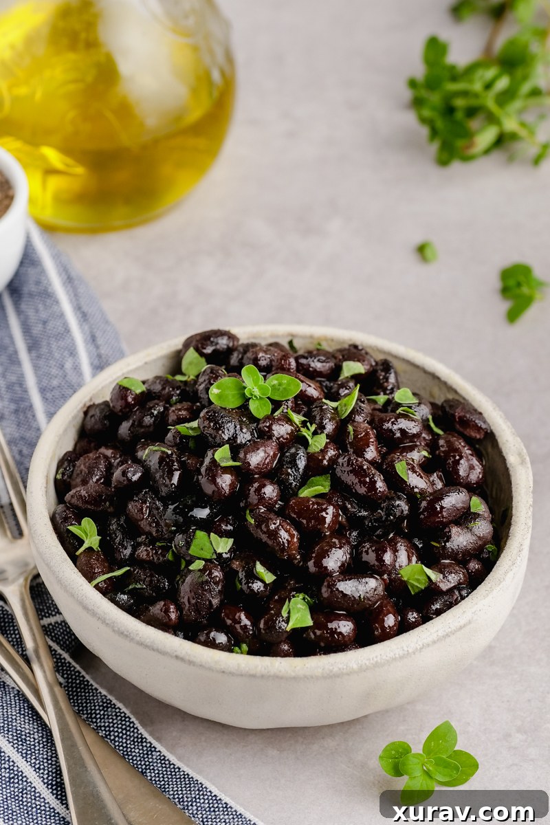 Instant pot black beans in a bowl with cilantro