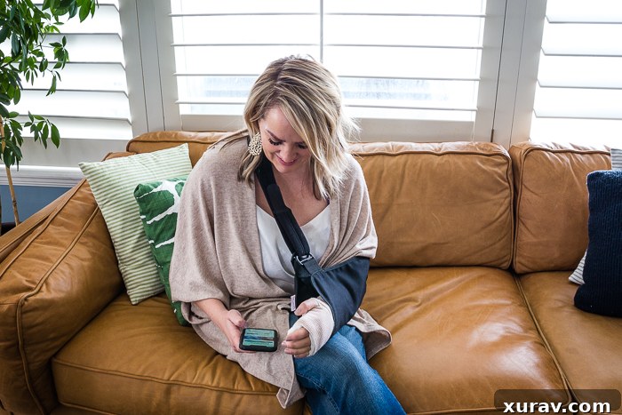 A person's hands holding a smartphone displaying the Ibotta app while shopping for groceries, illustrating how to earn cash back.