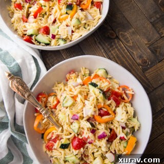 Close-up of Orzo Pasta Salad, highlighting the texture of the pasta and the fresh vegetables.