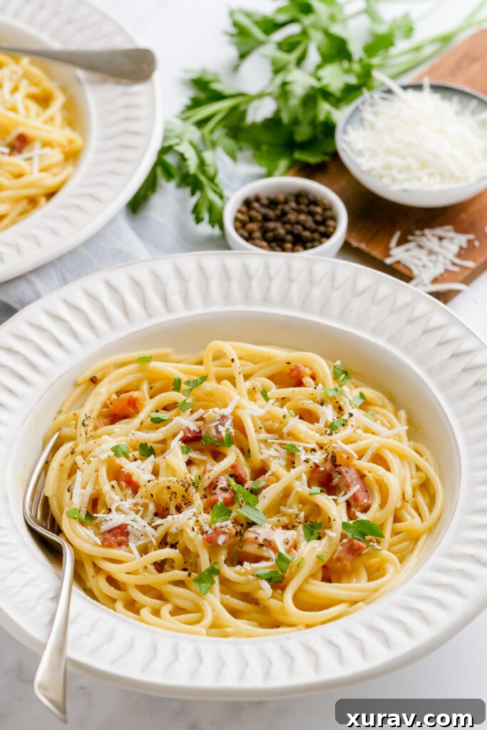A delicious plate of spaghetti carbonara, showcasing the creamy texture and crispy bacon, ready for an indulgent meal.
