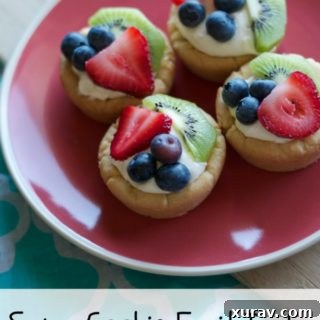 A beautifully arranged fruit tart with a sugar cookie base and fresh fruit.