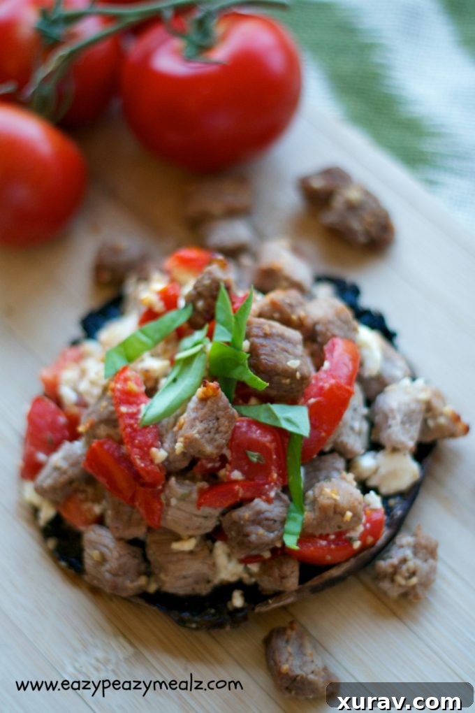 Generously stuffed portobello mushrooms before baking, showcasing the vibrant filling