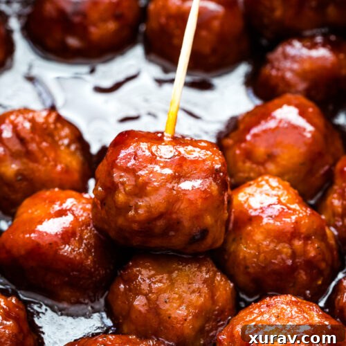 Sticky Sweet Slow Cooker Meatballs 6 Crockpot grape jelly meatballs are the perfect party appetizer.