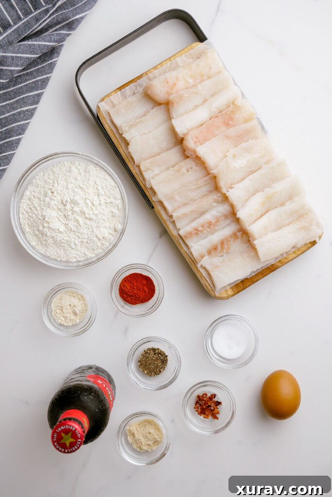 Ingredients laid out for making crispy beer battered fried fish