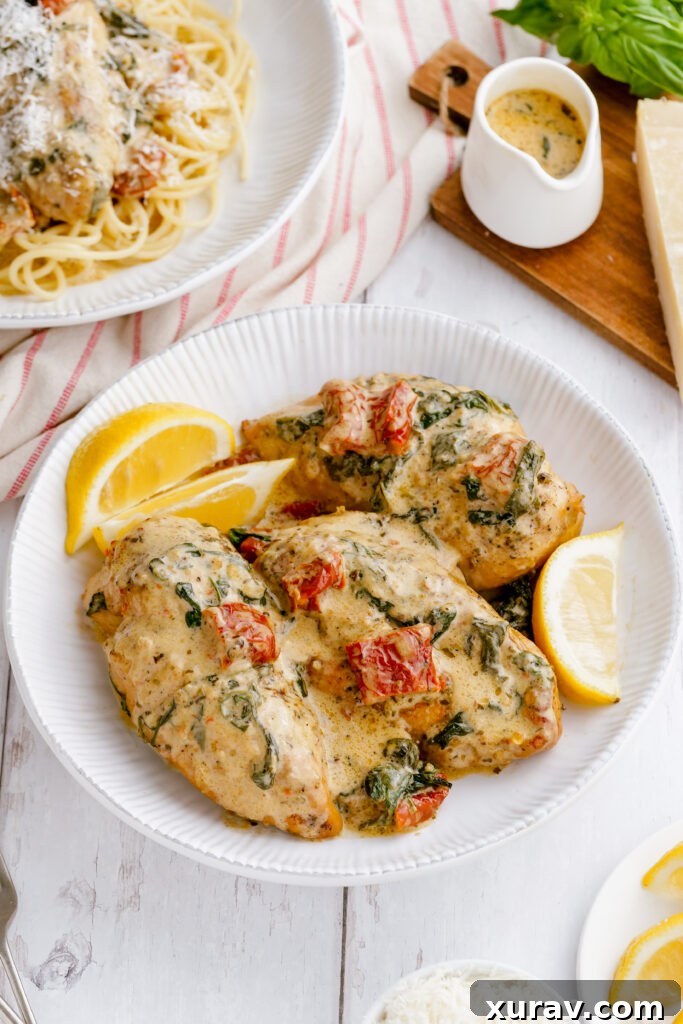 Finished Tuscan Chicken cooked in the pressure cooker and placed on a white platter