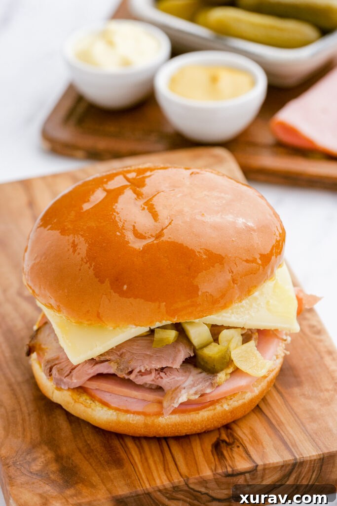 A Cuban sandwich being pressed in a panini press, creating a golden, crispy exterior.