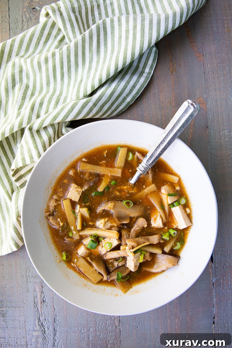 Hot and Sour Soup, Warm up with this flavorful hot and sour soup! Packed with bold spices, tangy vinegar, tender mushrooms, tofu, and a kick of heat, it's the perfect balance of savory, spicy, and sour.