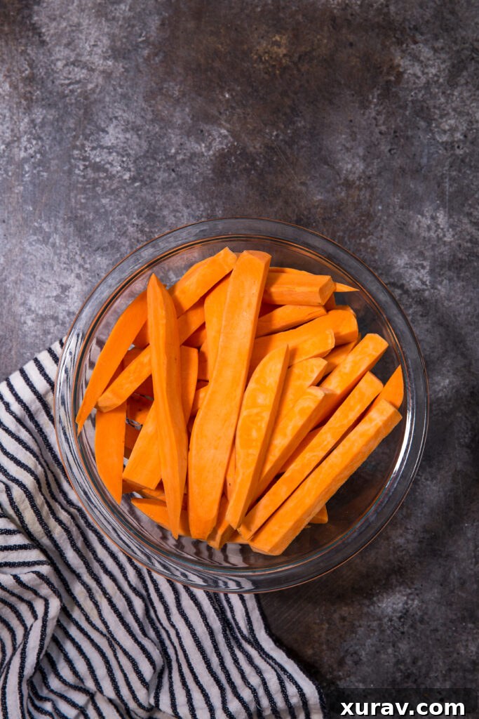 crispy sweet potato fries being prepped for the air fryer