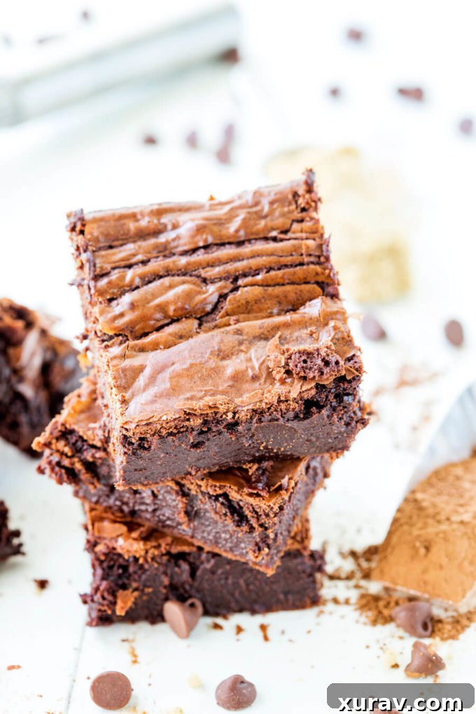 Rich and moist, these fudgy chocolate brownies are so amazing. Stacked for serving.