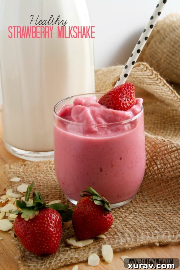 Healthy homemade strawberry milkshake with fresh berries