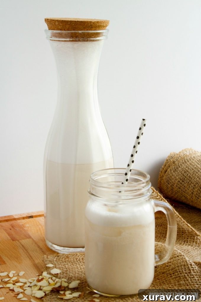 Homemade almond milk being poured