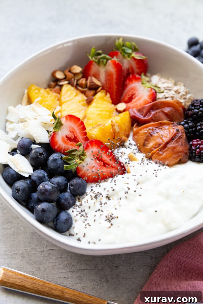 Cottage Cheese Breakfast Bowl, topped with fresh fruit and grilled fruit. 