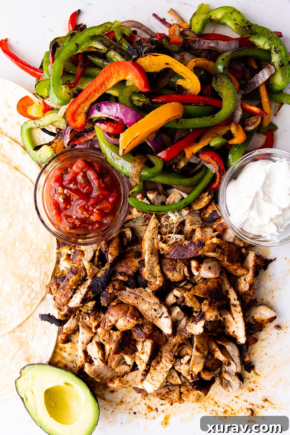 Easy Chicken Fajitas - A super simple recipe for classic chicken fajitas cooked stove top or on the grill or griddle. Featuring tender chicken and colorful vegetables.