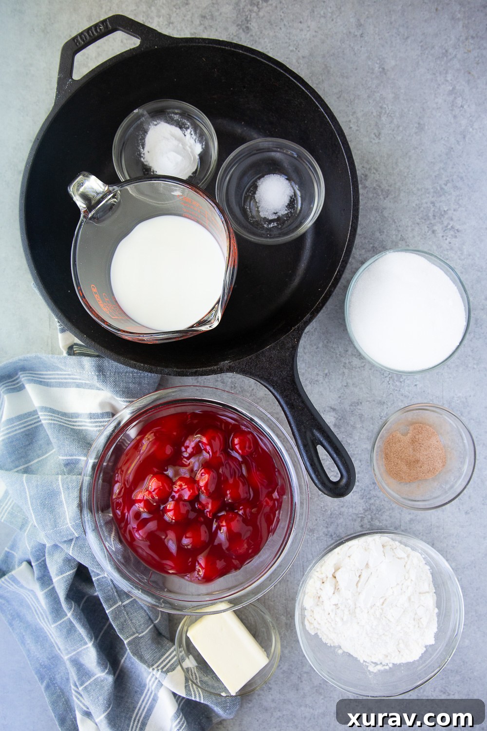 Cherry cobbler ingredients for a cast iron or Dutch oven cobbler with Montmorency tart cherries, neatly laid out on a kitchen counter.