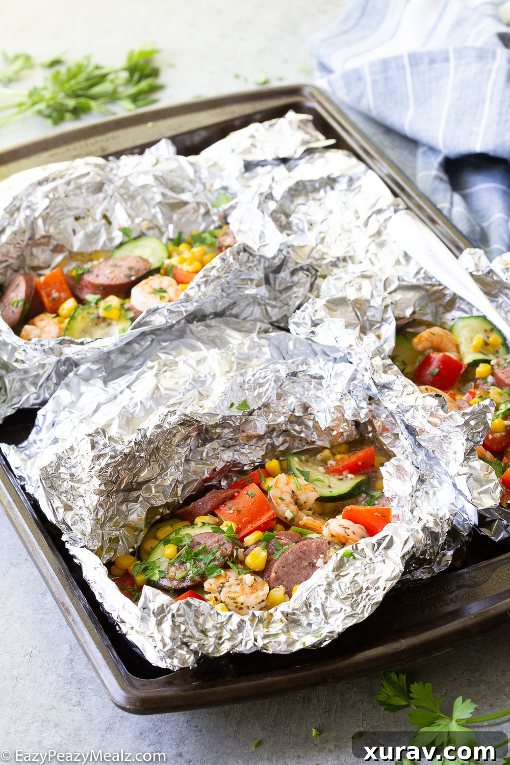 Shrimp and Kielbasa foil packs baked in the oven. 