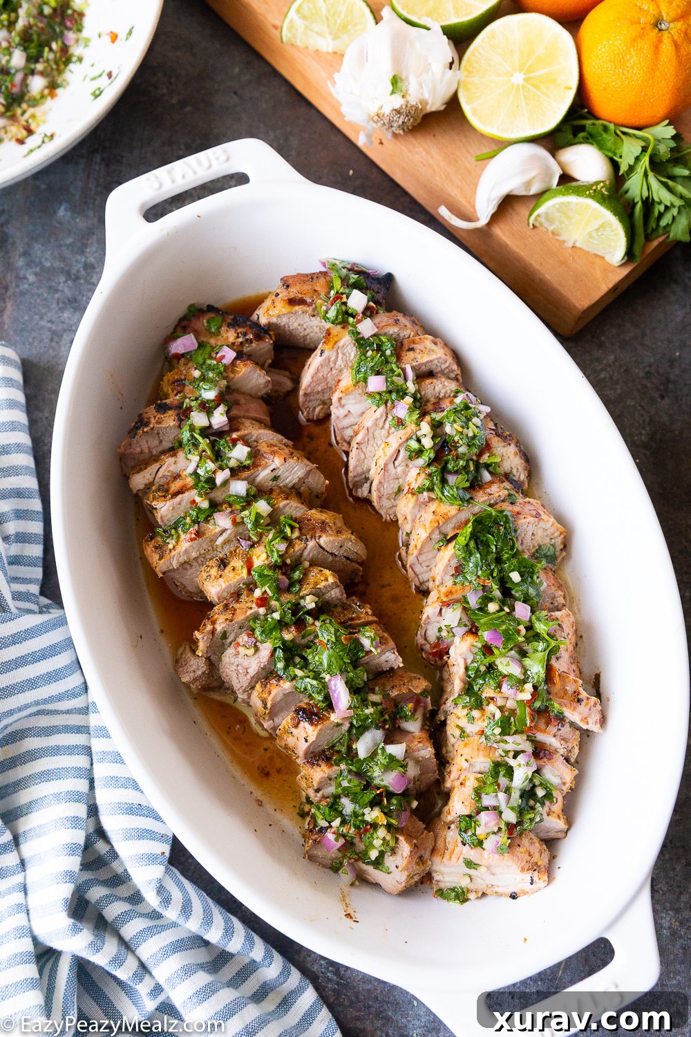 Flavor-packed grilled pork tenderloin, marinated in citrus and topped with fresh chimichurri sauce