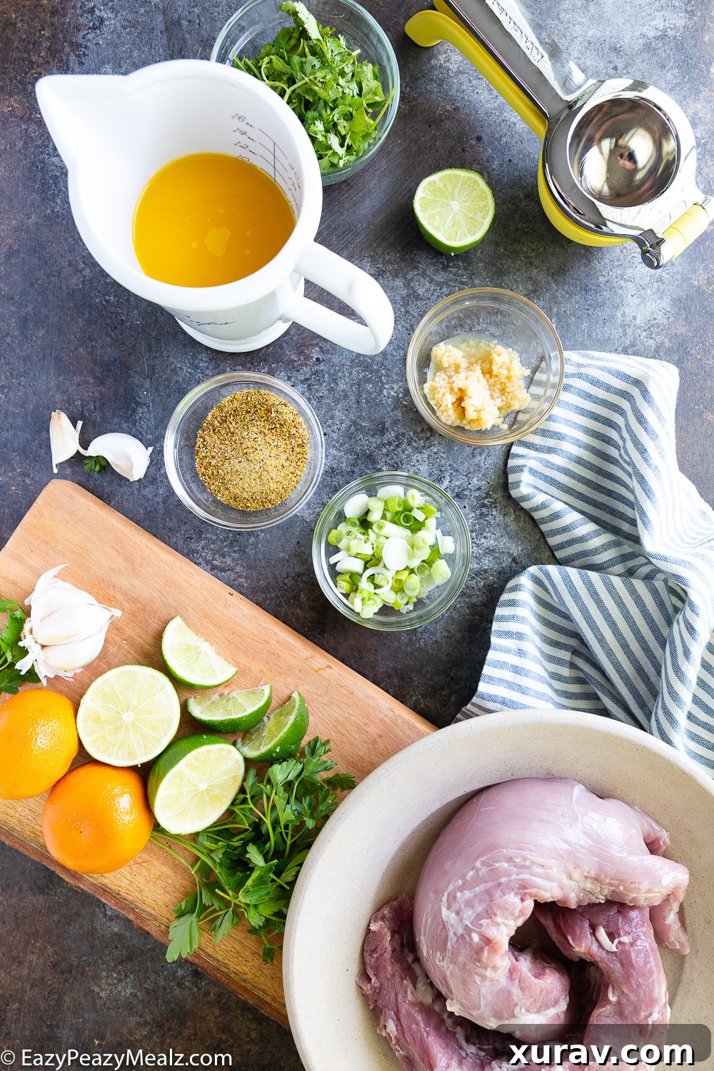 All fresh ingredients laid out for making the grilled citrus marinated pork tenderloin and chimichurri