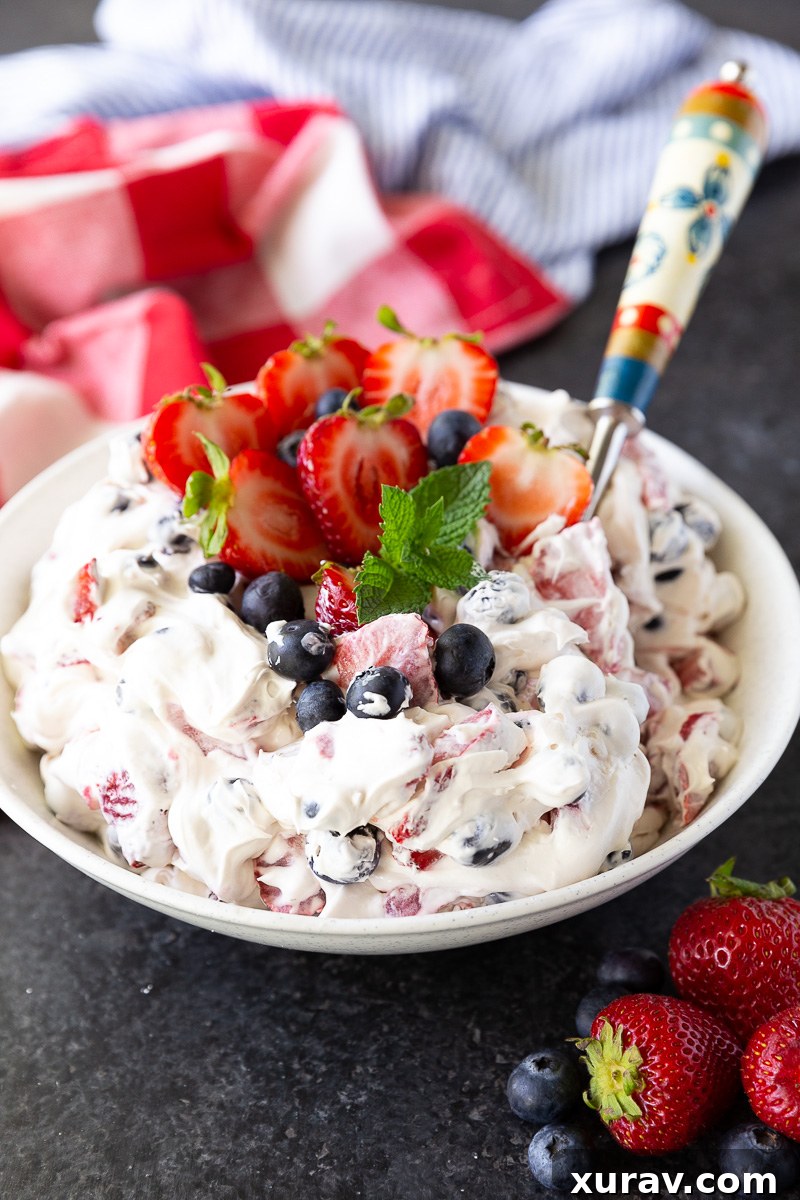 A big bowl of berry cheesecake salad, perfect for the 4th of july